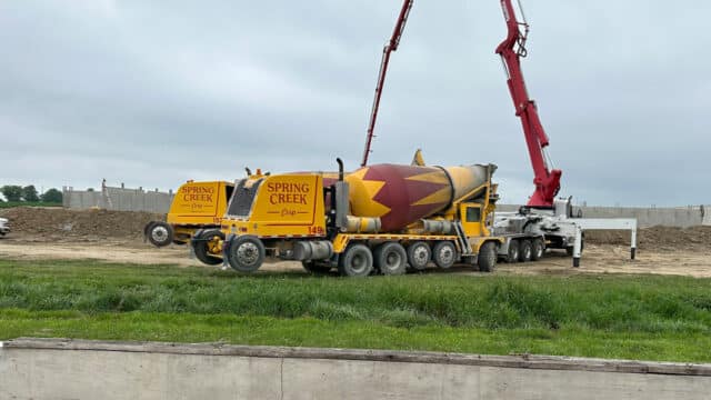 A Spring Creek cement truck at a worksite.