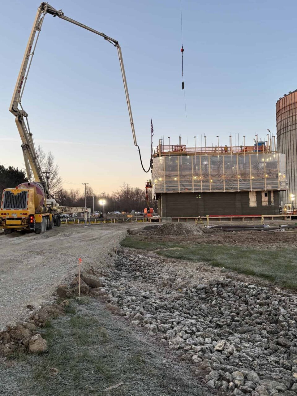 Concrete pouring at Spring Creek's Hardin plant site, showcasing new plant projects and equipment upgrades.